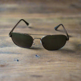 Sunglasses on a textured surface with a blurred background
