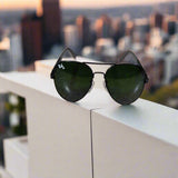 Sunglasses on a textured surface with a blurred background